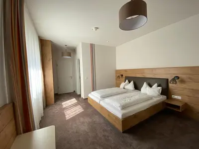 Ein Bett oder Betten in einem Zimmer der Unterkunft Hotel-Pension Scharl am Maibaum