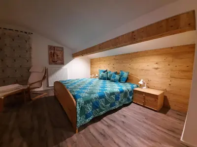 Ein Bett oder Betten in einem Zimmer der Unterkunft Landhaus Hochgern