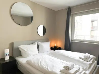 Ein Bett oder Betten in einem Zimmer der Unterkunft Hotel Sendlinger Tor