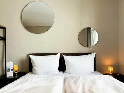 Ein Bett oder Betten in einem Zimmer der Unterkunft Hotel Sendlinger Tor