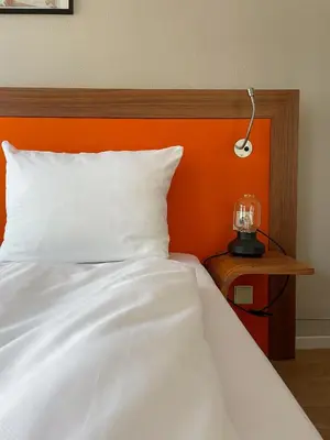 Ein Bett oder Betten in einem Zimmer der Unterkunft Hotel Sendlinger Tor