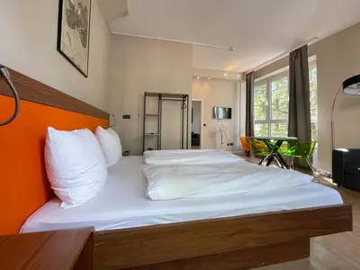 Ein Bett oder Betten in einem Zimmer der Unterkunft Hotel Sendlinger Tor