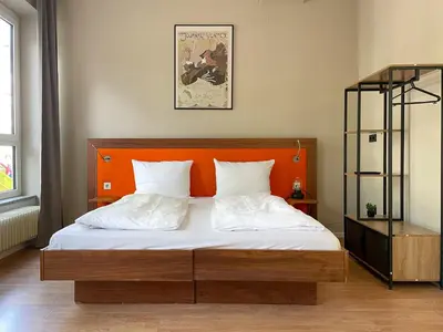 Ein Bett oder Betten in einem Zimmer der Unterkunft Hotel Sendlinger Tor
