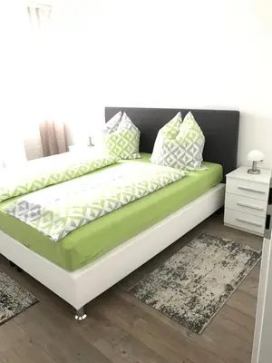 Ein Bett oder Betten in einem Zimmer der Unterkunft City Apartment