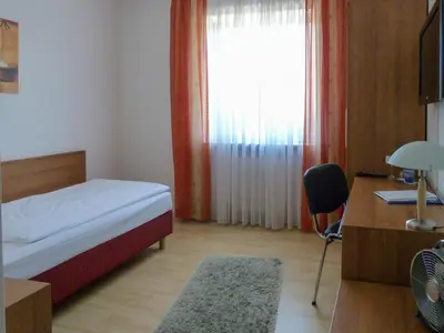 Ein Bett oder Betten in einem Zimmer der Unterkunft City Hotel