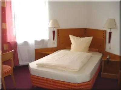 Ein Bett oder Betten in einem Zimmer der Unterkunft City Hotel