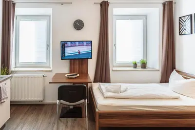 Ein Bett oder Betten in einem Zimmer der Unterkunft greenpartment Boardinghouse Neustadt