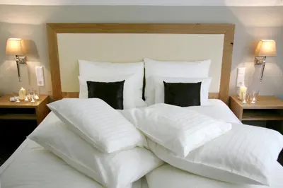 Ein Bett oder Betten in einem Zimmer der Unterkunft GÄSTEHAUS an der Sempt Ferienwohnungen & Apartements