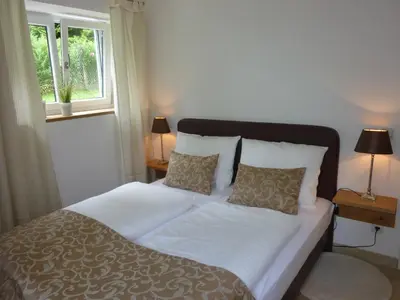 Ein Bett oder Betten in einem Zimmer der Unterkunft GÄSTEHAUS an der Sempt Ferienwohnungen & Apartements