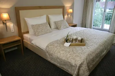 Ein Bett oder Betten in einem Zimmer der Unterkunft GÄSTEHAUS an der Sempt Ferienwohnungen & Apartements