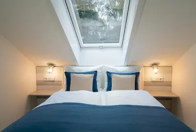 Ein Bett oder Betten in einem Zimmer der Unterkunft GÄSTEHAUS an der Sempt Ferienwohnungen & Apartements
