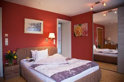 Ein Bett oder Betten in einem Zimmer der Unterkunft Kurhotel Weber
