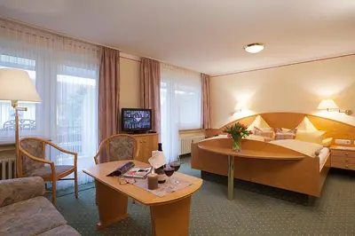 Ein Bett oder Betten in einem Zimmer der Unterkunft Kurhotel Weber