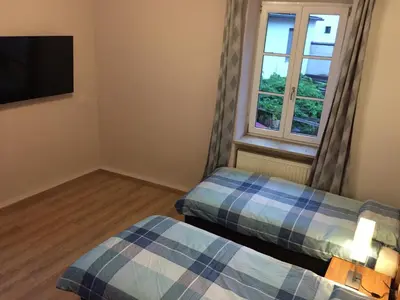Ein Bett oder Betten in einem Zimmer der Unterkunft Jujhar's Gästehaus