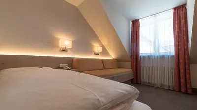 Ein Bett oder Betten in einem Zimmer der Unterkunft Hotel Lutter