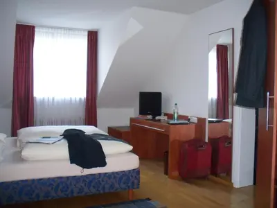 Ein Bett oder Betten in einem Zimmer der Unterkunft Hotel Lutter