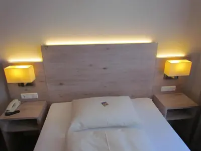 Ein Bett oder Betten in einem Zimmer der Unterkunft Hotel Lutter