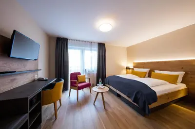 Ein Bett oder Betten in einem Zimmer der Unterkunft Landhotel Endhart