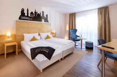 Ein Bett oder Betten in einem Zimmer der Unterkunft Landhotel Endhart