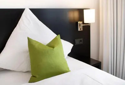 Ein Bett oder Betten in einem Zimmer der Unterkunft GA Hotel by WMM Hotels