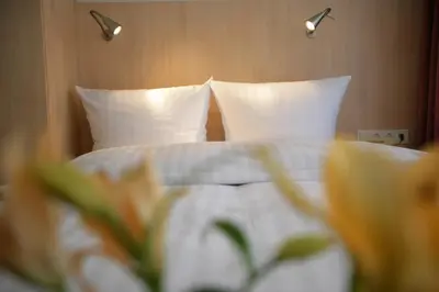 Ein Bett oder Betten in einem Zimmer der Unterkunft Hotel Senator München