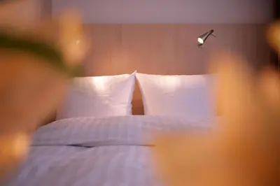 Ein Bett oder Betten in einem Zimmer der Unterkunft Hotel Senator München