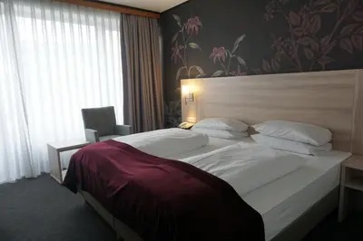 Ein Bett oder Betten in einem Zimmer der Unterkunft Hotel Senator München