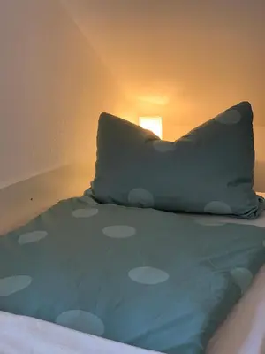Ein Bett oder Betten in einem Zimmer der Unterkunft Ferienwohnung Munchen