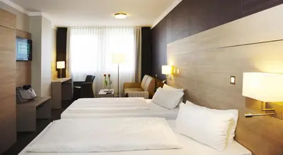 Ein Bett oder Betten in einem Zimmer der Unterkunft Stern Hotel Soller