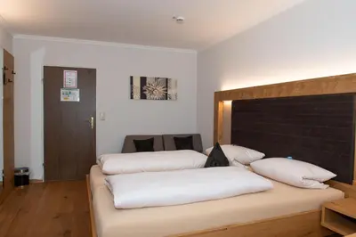 Ein Bett oder Betten in einem Zimmer der Unterkunft Hotel Bockmaier