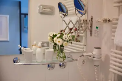 Ein Badezimmer in der Unterkunft Hotel Metropol by Maier Privathotels