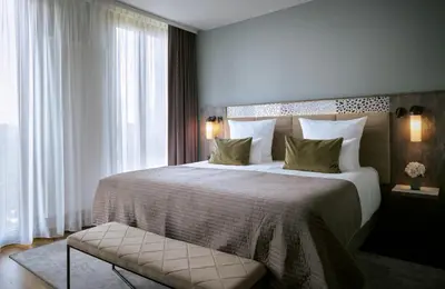 Ein Bett oder Betten in einem Zimmer der Unterkunft Leonardo Royal Hotel Munich
