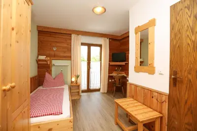 Ein Bett oder Betten in einem Zimmer der Unterkunft Pension Bergsee