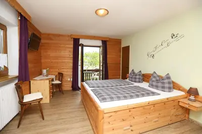 Ein Bett oder Betten in einem Zimmer der Unterkunft Pension Bergsee