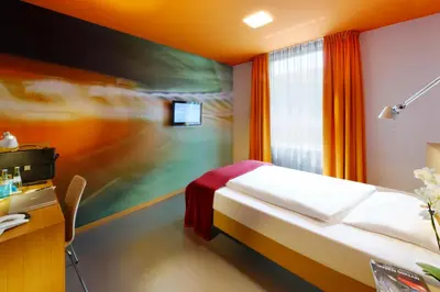 Ein Bett oder Betten in einem Zimmer der Unterkunft Hotel Königstein