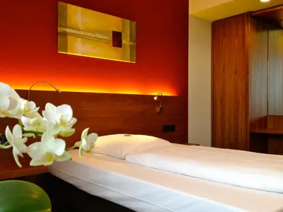 Ein Bett oder Betten in einem Zimmer der Unterkunft Hotel Königstein
