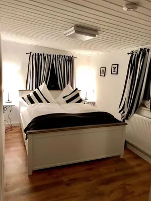 Ein Bett oder Betten in einem Zimmer der Unterkunft Ilmhaus 2