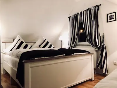 Ein Bett oder Betten in einem Zimmer der Unterkunft Ilmhaus 2