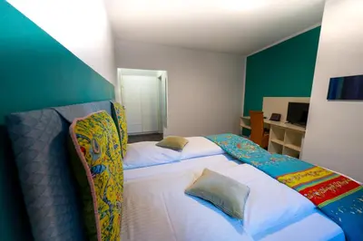 Ein Bett oder Betten in einem Zimmer der Unterkunft Hotel Bergbauer mit Late-Self-Check-IN