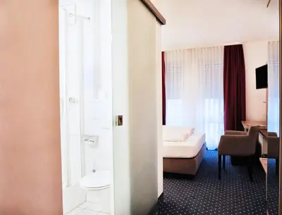 Ein Sitzbereich in der Unterkunft Hotel Poinger Hof