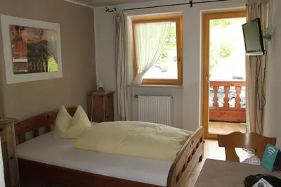 Ein Bett oder Betten in einem Zimmer der Unterkunft Berggasthof Hummelei
