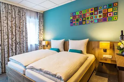 Ein Bett oder Betten in einem Zimmer der Unterkunft das MAX Appartementhaus