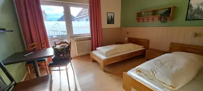 Ein Bett oder Betten in einem Zimmer der Unterkunft Backerwirt - Wohnen und Schlafen