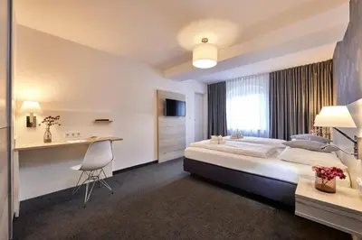 Ein Bett oder Betten in einem Zimmer der Unterkunft Hotel Alter Wirth