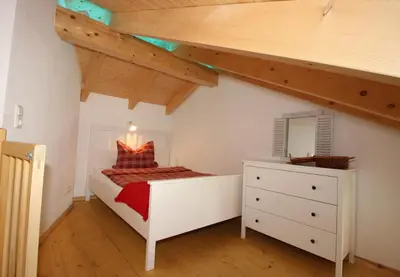 Ein Bett oder Betten in einem Zimmer der Unterkunft Haus Chiemsee-Blick