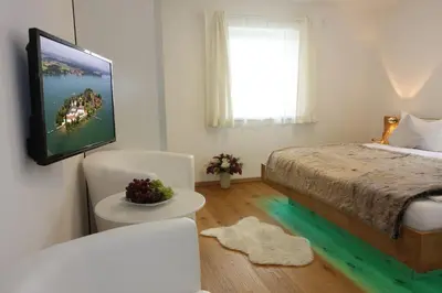 Ein Bett oder Betten in einem Zimmer der Unterkunft Haus Chiemsee-Blick