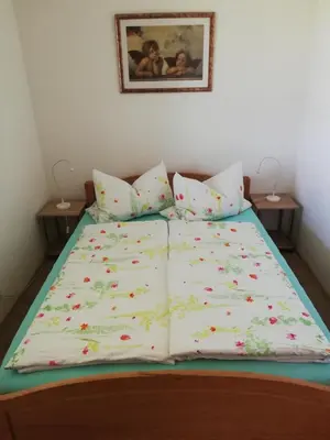 Ein Bett oder Betten in einem Zimmer der Unterkunft Ferienwohnung am Golfplatz