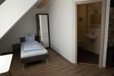 Ein Bett oder Betten in einem Zimmer der Unterkunft Pension Sonntag