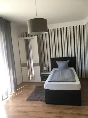 Ein Bett oder Betten in einem Zimmer der Unterkunft Pension Sonntag