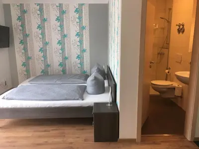 Ein Bett oder Betten in einem Zimmer der Unterkunft Pension Sonntag